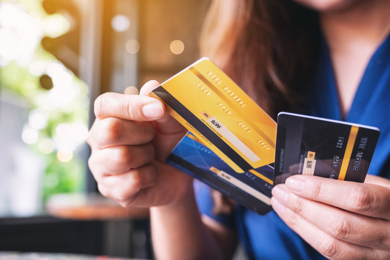 Woman's hand holding credit cards