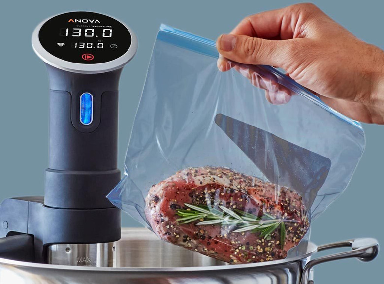 Anova sous vide precision cooker being used to cook a steak