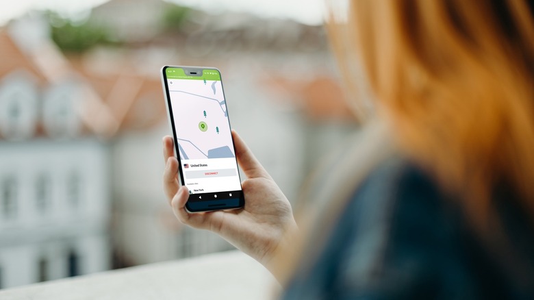 A person using NordVPN, one of the Best VPNS, on their phone.