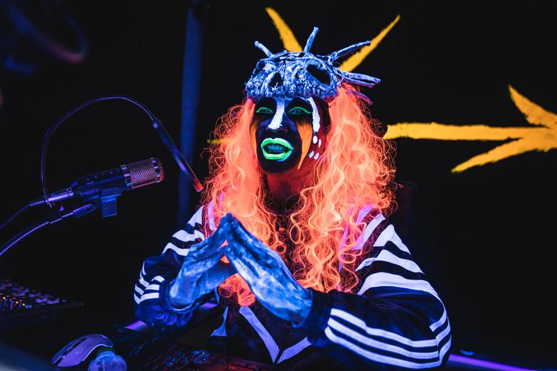 person in brightly colored skull mask
