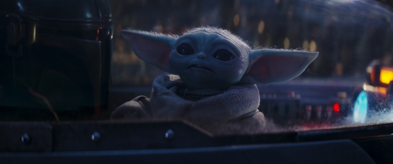 (L-R): Din Djarin (Pedro Pascal) and Grogu in Lucasfilm's THE MANDALORIAN season 3.