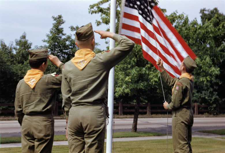 Boy Scouts saluting flag