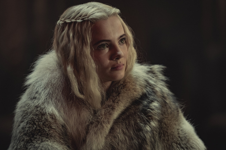 woman with blonde hair in fur coat