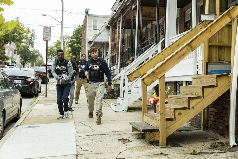 police officers approaching a house