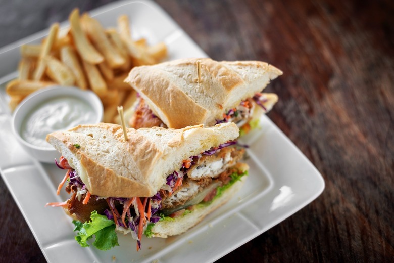 Fish fillet sandwiches with fries on a plate