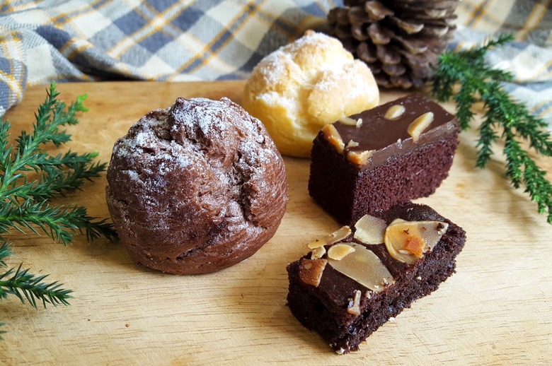Cream puffs and brownies on a table