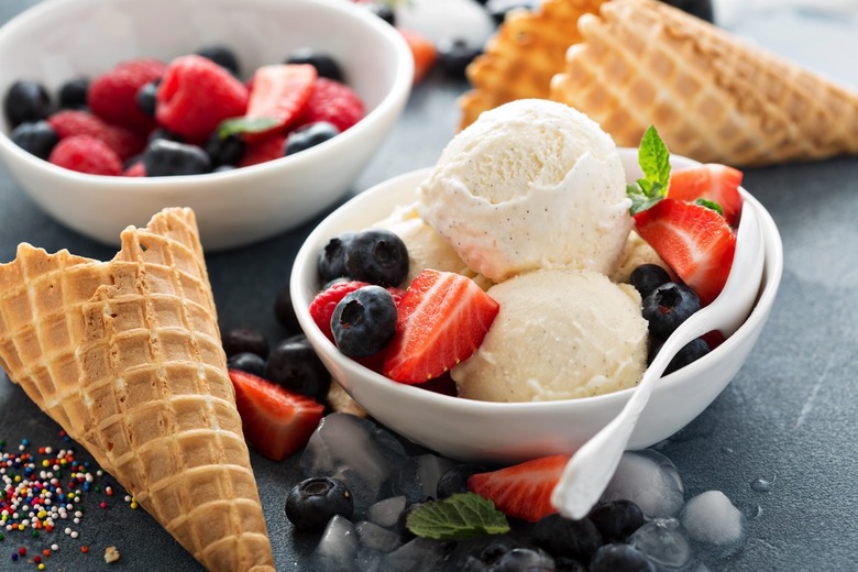 Vanilla ice cream scoops with fresh berries