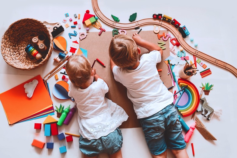 Children playing with toys on the floor