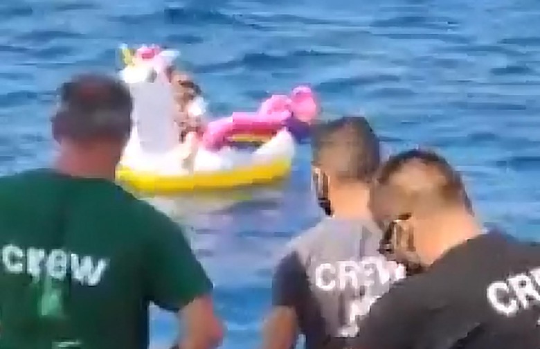 girl on inflatable unicorn