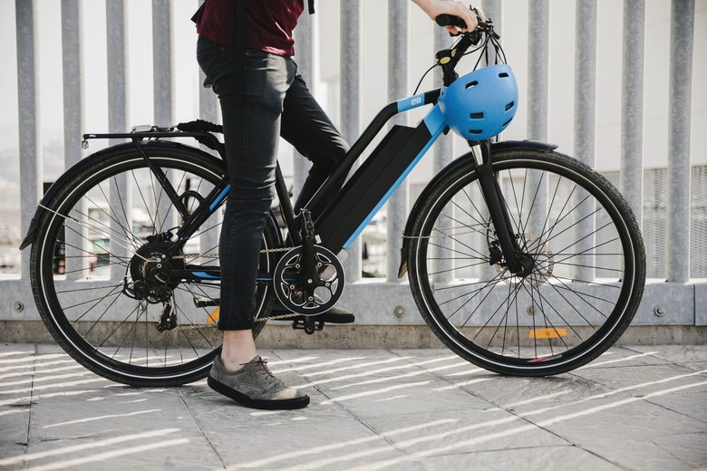 Urban cyclist taking a brake on e-bike.