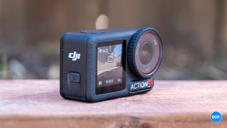 Black DJI Osmo Action 5 Pro on a wooden surface