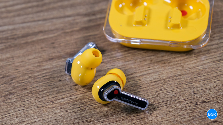 Nothing Ear (a) earbuds outside of the charging case