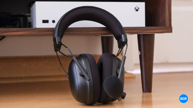 Razer BlackShark V2 Pro for Xbox in front of a white Xbox