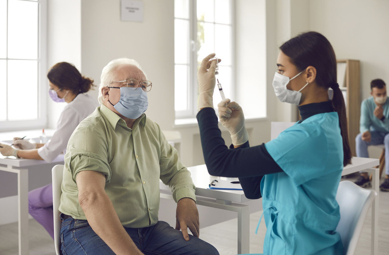 nurse with old man face mask