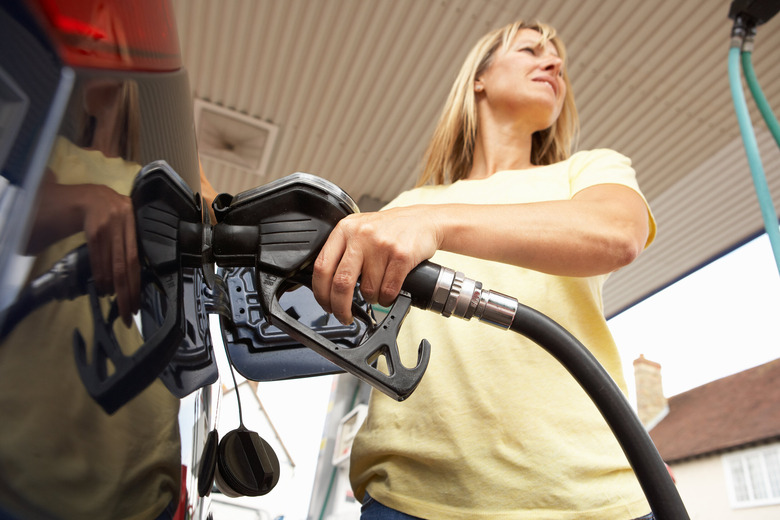 woman pumping gas