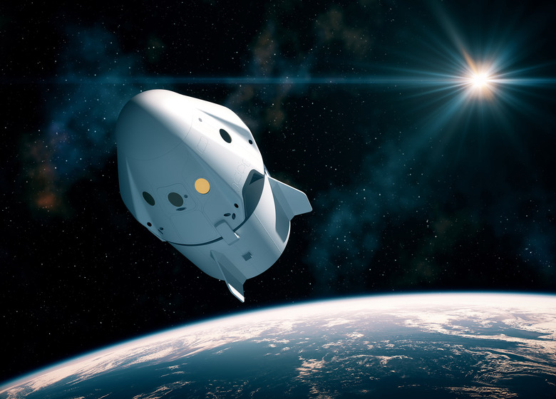 Space Capsule Orbiting Planet Earth
