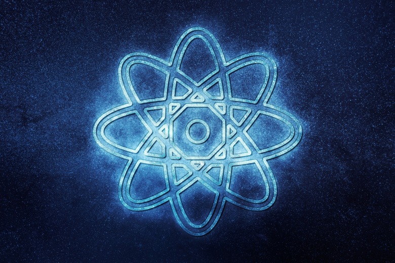 glowing atom symbol with blue background behind it