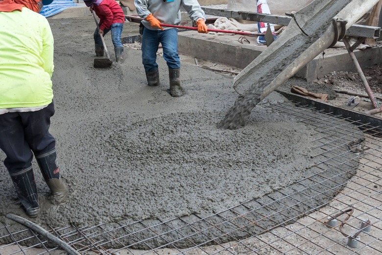 concrete being poured at construction site