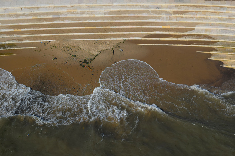 Water waves corroding stone steps, top view