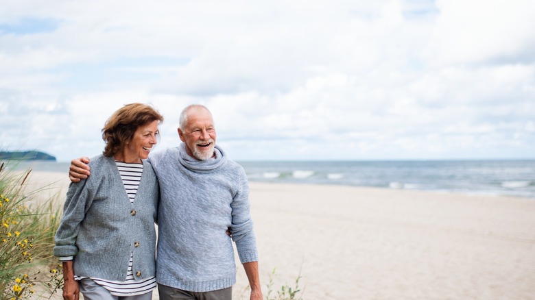 old man and woman walking