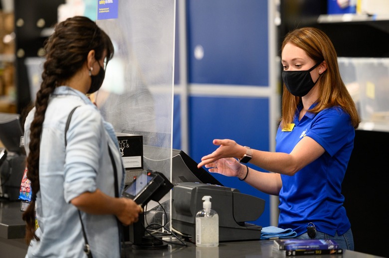 Best Buy employee helping a customer.