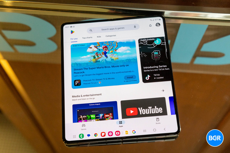 Samsung Fold 5 a on a mirrored background showing the Google Play store.