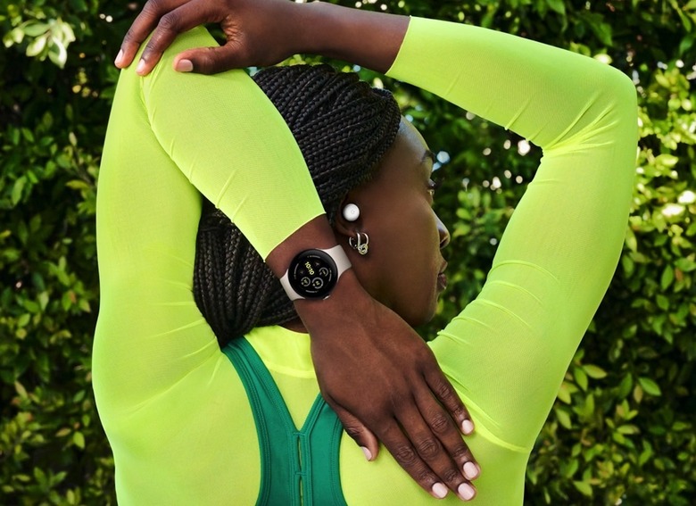 A person wearing the Pixel Watch 3 and Pixel Buds Pro 2.