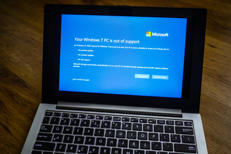 Warning notification is displayed on a laptop running Windows 7 operating system in Poland, on 25 February, 2020.