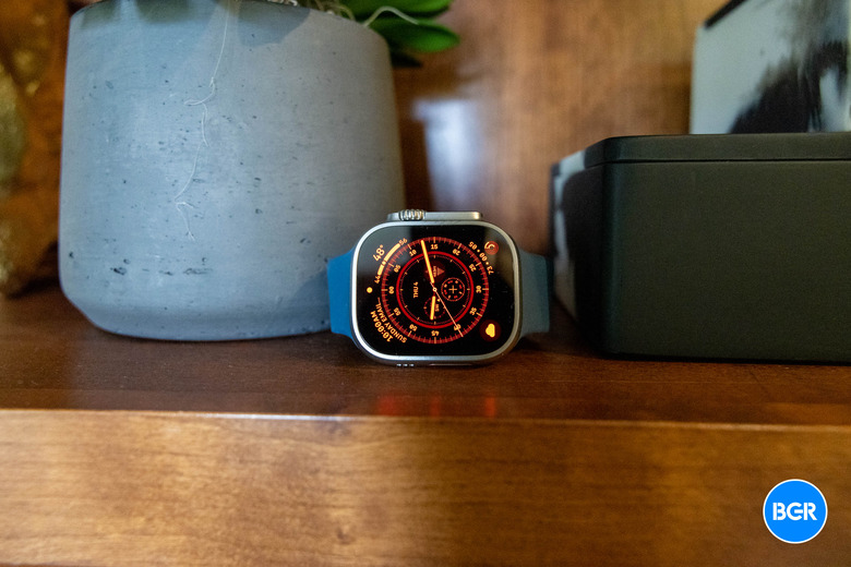 Apple Watch Ultra on a wood shelf