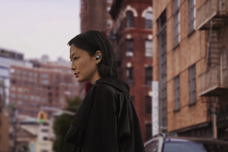 A person using the Google Pixel Buds Pro wireless earphones.