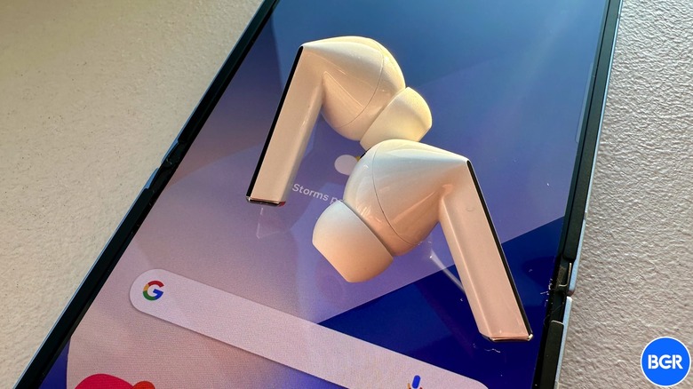 Galaxy Buds 3 Pro on top of Galaxy Z Flip 6.