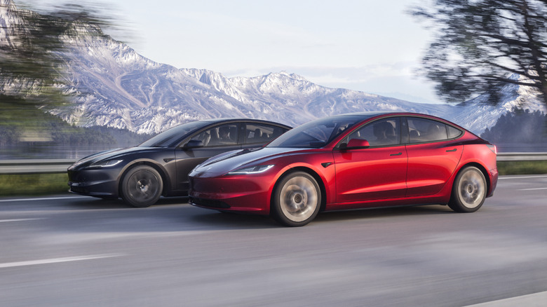 Tesla Model 3 in red and gray.