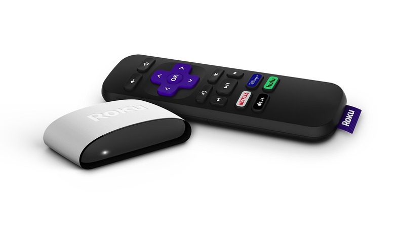 The Roku LE streaming stick next to the remote