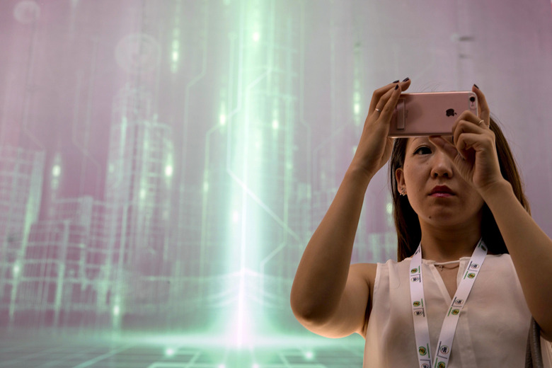 woman-using-iphone-future-data-sign