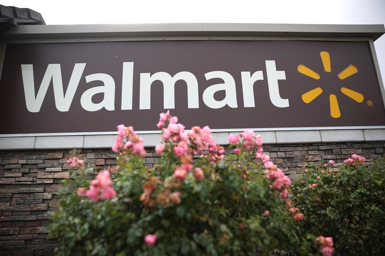 A sign is posted in front of a Walmart store on November 16, 2021 in American Canyon, California.